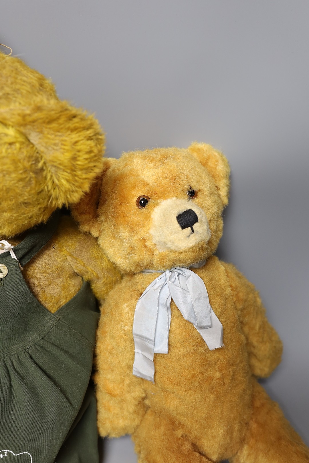 A 1930's bear in green dress, 58cm, with a synthetic European Bear, 40cm, and a synthetic european bear, 47cm, also a invicta beard, 40cm